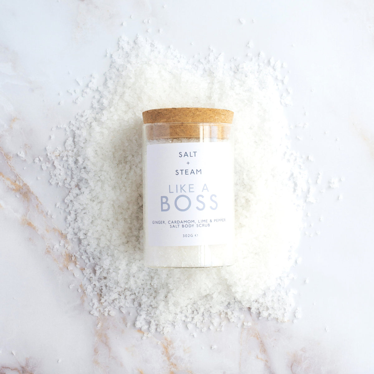 Salt + Steam Like A Boss body scrub being applied to skin