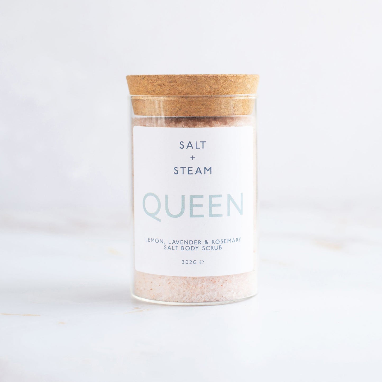 Salt + Steam Queen body scrub being applied to skin