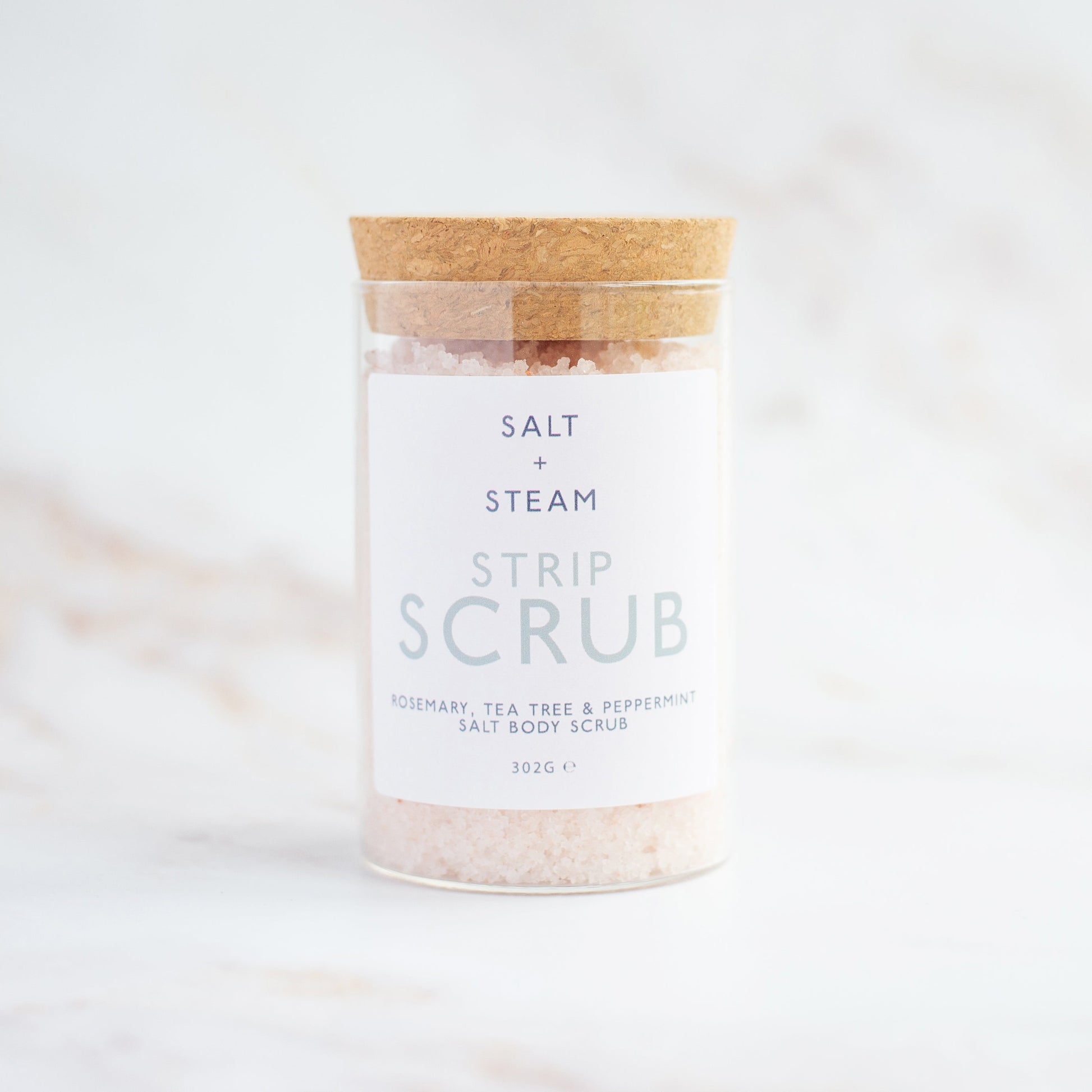 Salt + Steam Strip Scrub body scrub being applied to skin