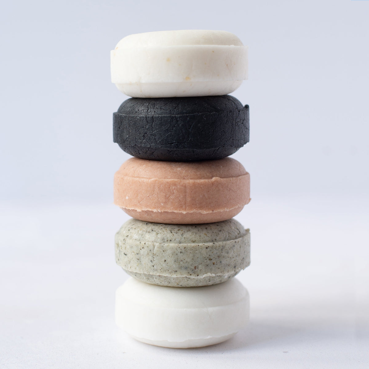 Curling Me Softly shampoo bar being used in the shower