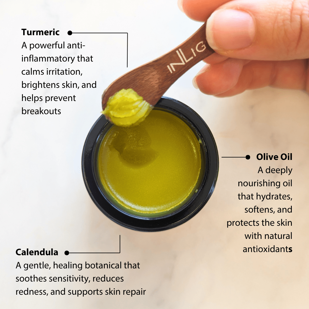 Hand holding a wooden spoon with green paste over a container of the same paste of Inlight Beauty Turmeric & Calendula Relief Balm 45ml, labeled with ingredients and benefits.