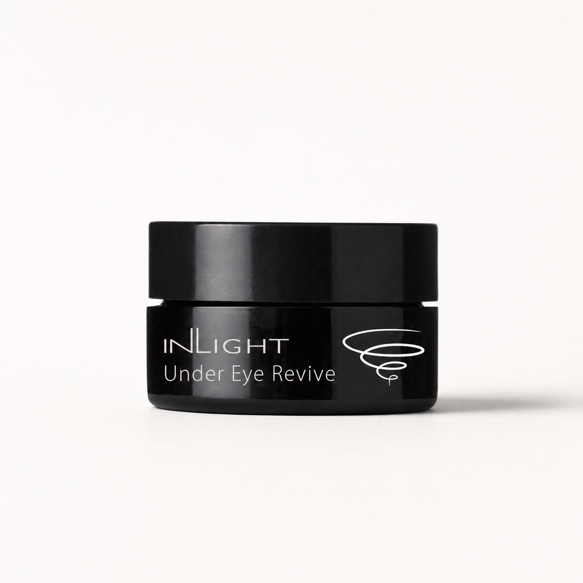 Black jar of Inlight Beauty Under Eye Revive 12ml cream on a white background