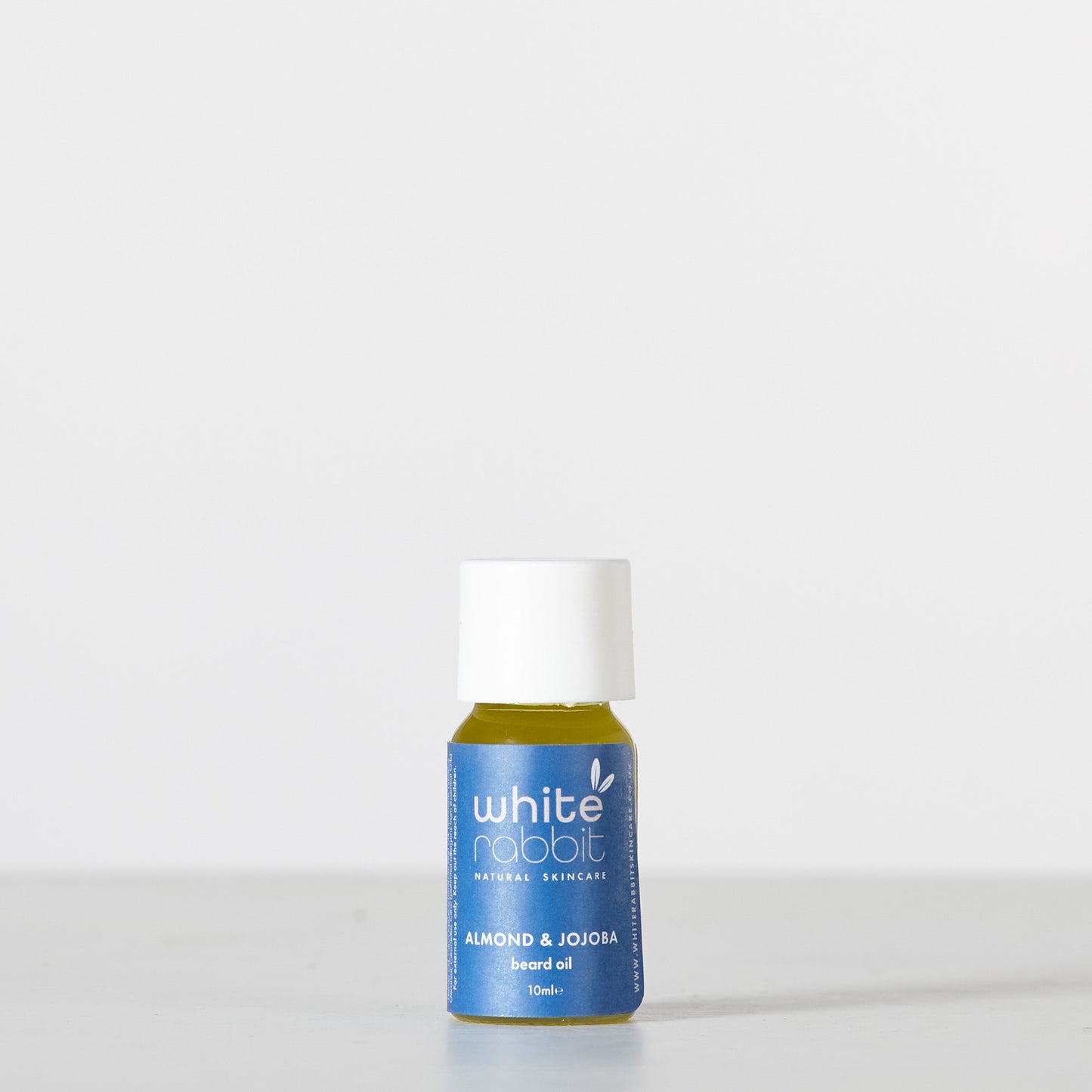 White Rabbit skincare bottle on a white background