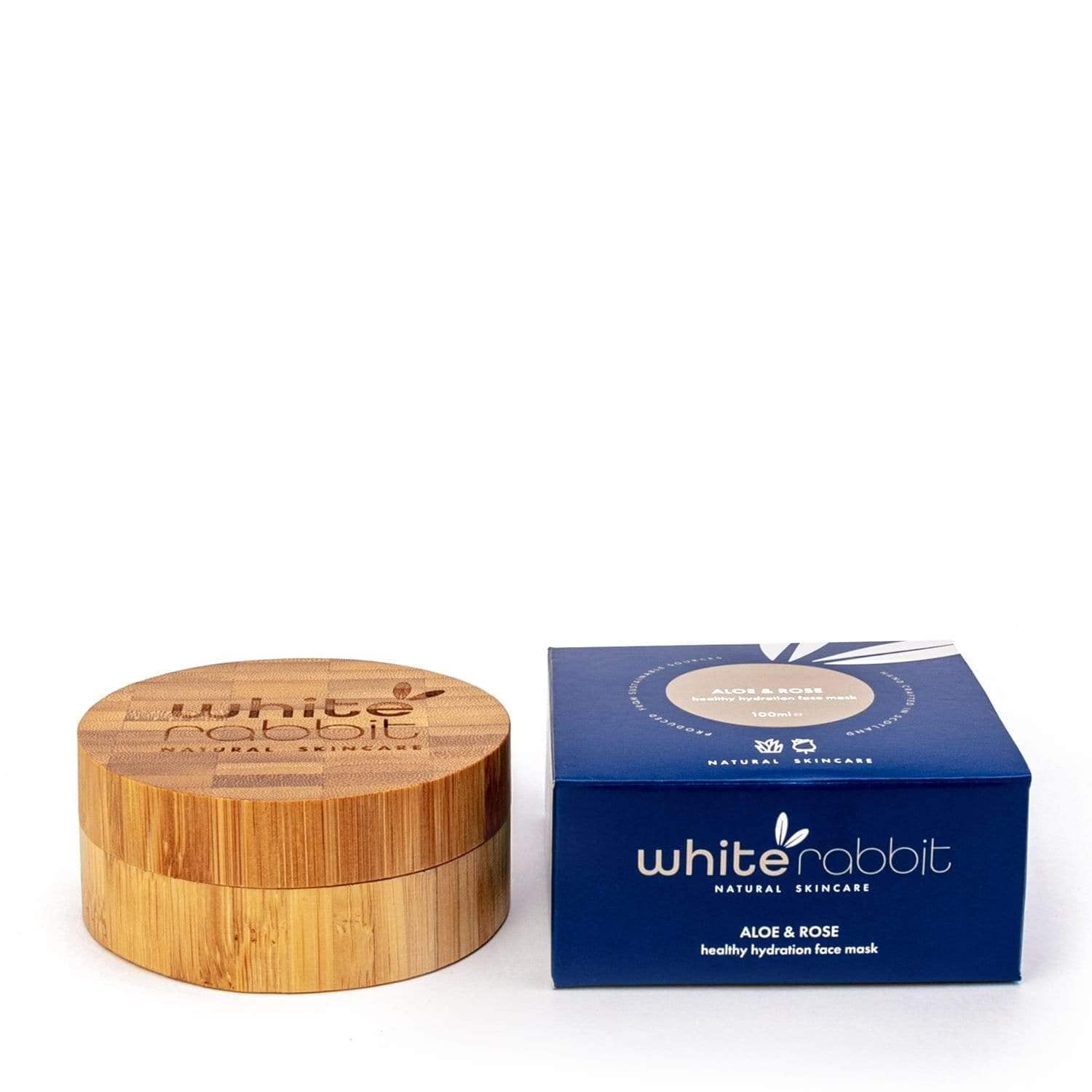 White Rabbit skincare product with bamboo lid and blue box on a white background