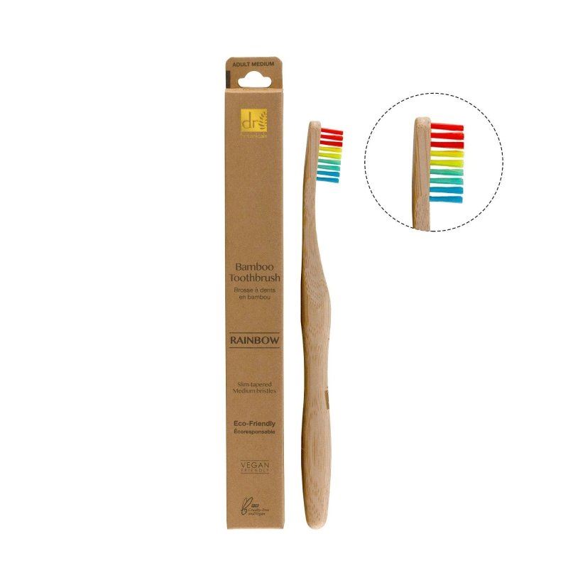 Bamboo toothbrush with rainbow bristles and packaging on a white background