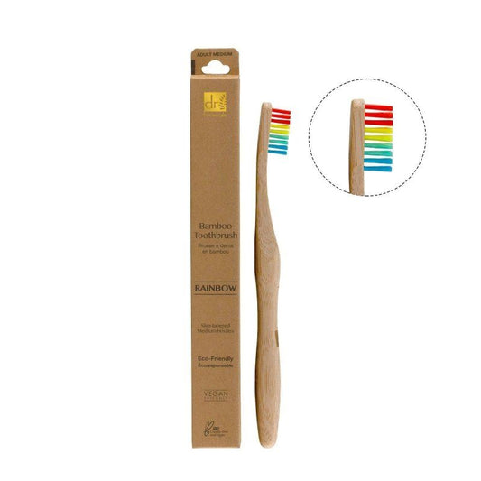 Bamboo toothbrush with rainbow bristles and packaging on a white background