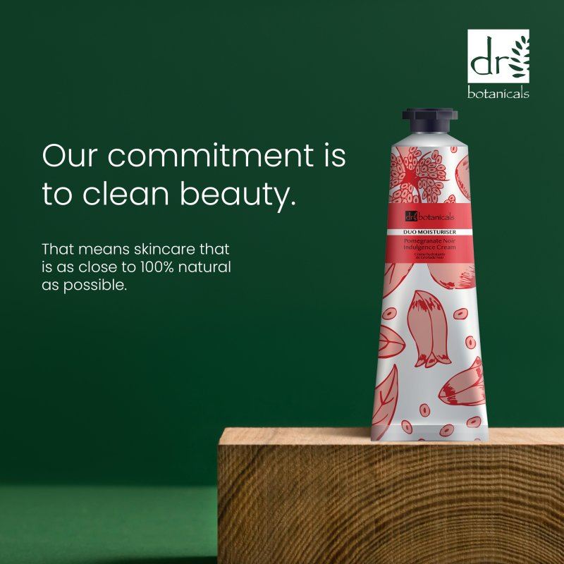 Dr Botanicals skincare product on a wooden block with a green background and brand logo.