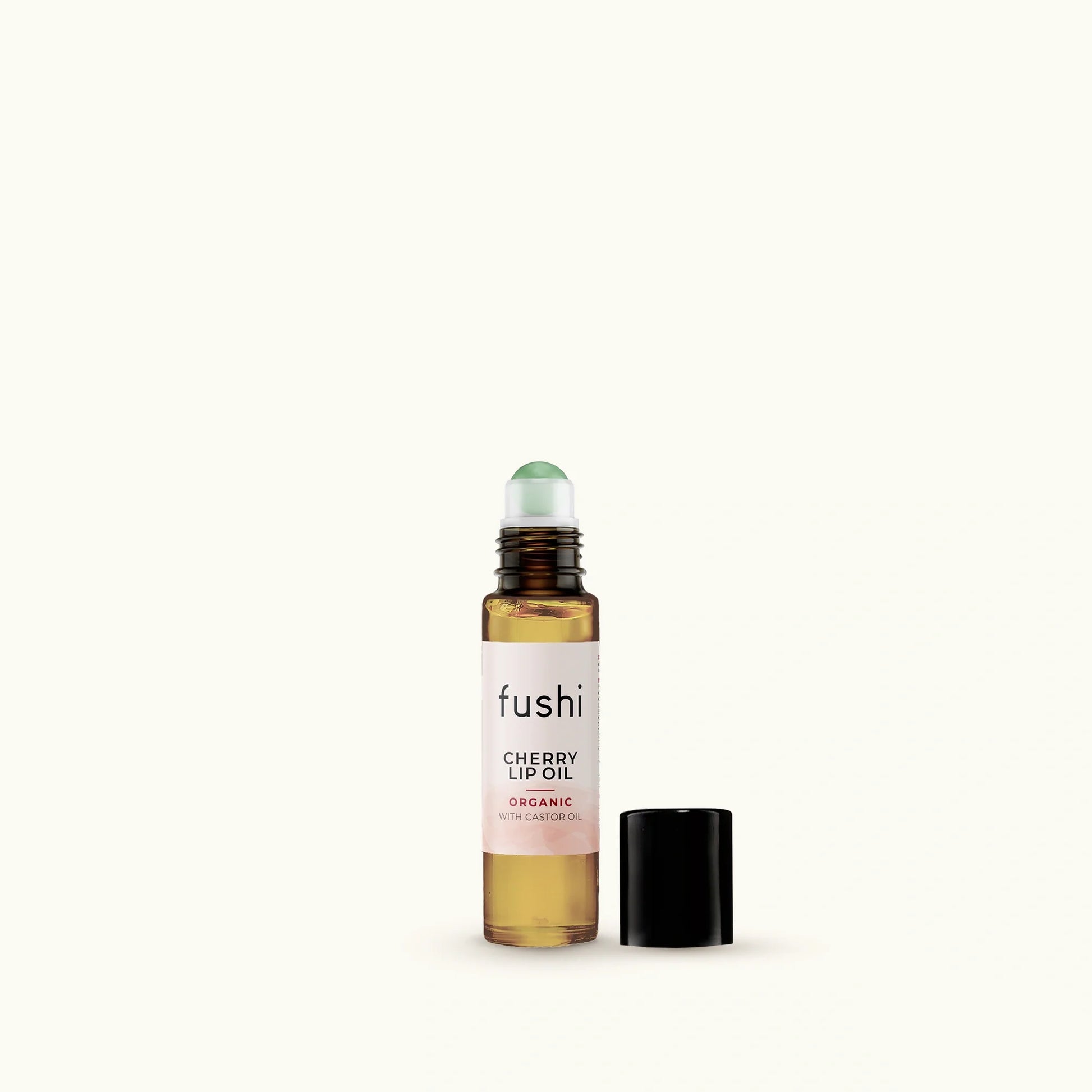 Fushi cherry lip oil bottle on a white background