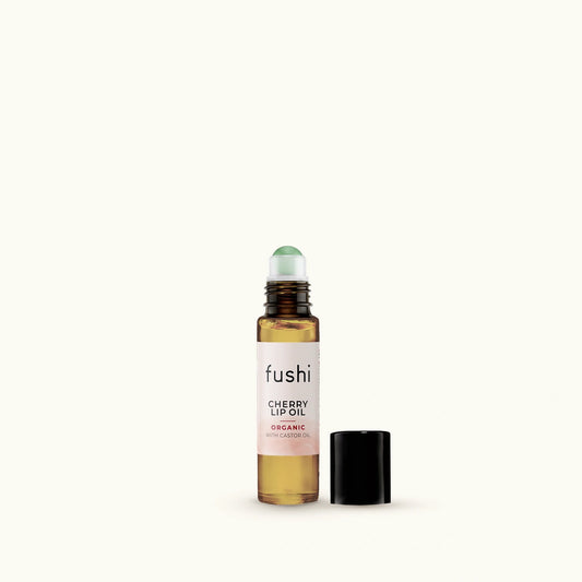 Fushi cherry lip oil bottle on a white background