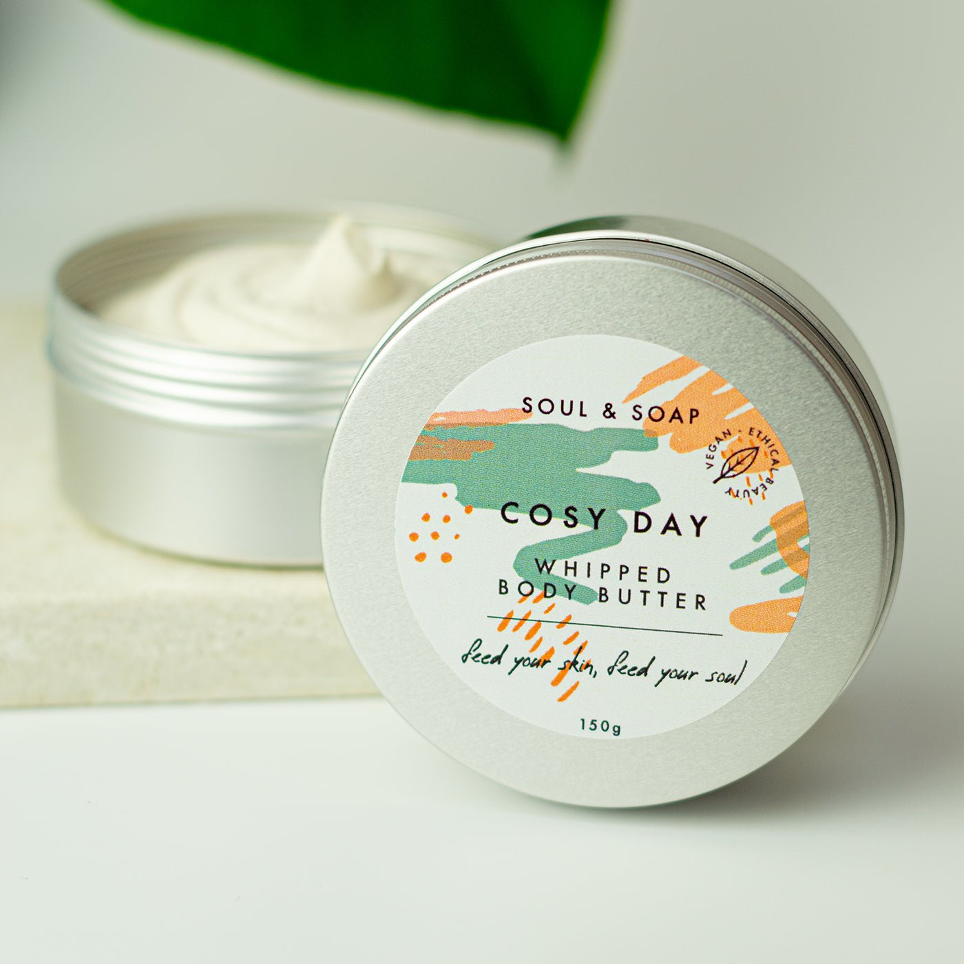 Cosy Day whipped body butter container with a visible brand label on a neutral background