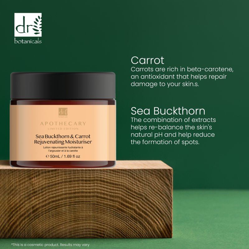 Cosmetic jar with Sea Buckthorn & Carrot Rejuvenating Moisturizer on a wooden block against a green background, featuring Dr Botanicals branding.