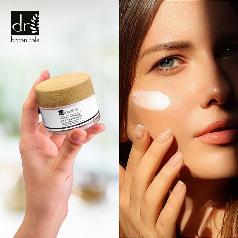 Dr Botanicals jar with a woman applying cream to her face