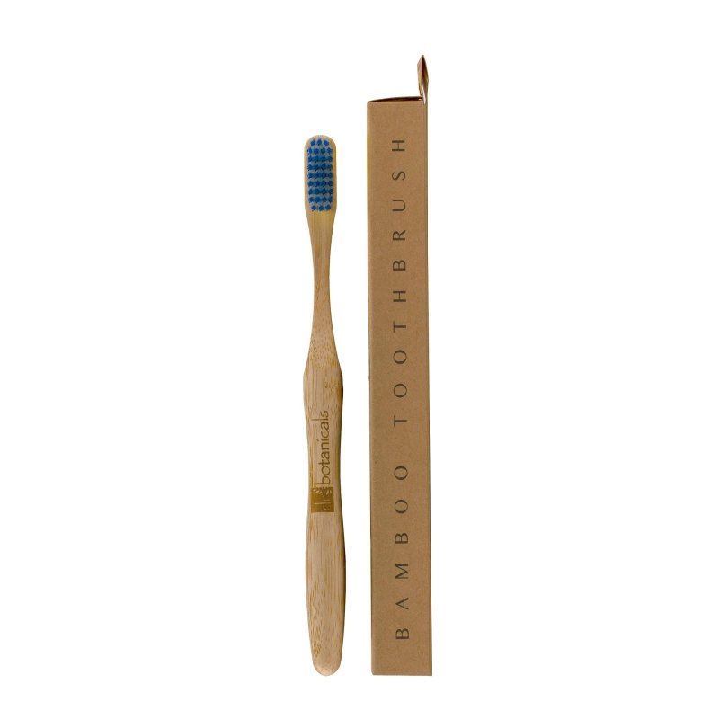 Bamboo toothbrush with blue bristles and packaging on a white background