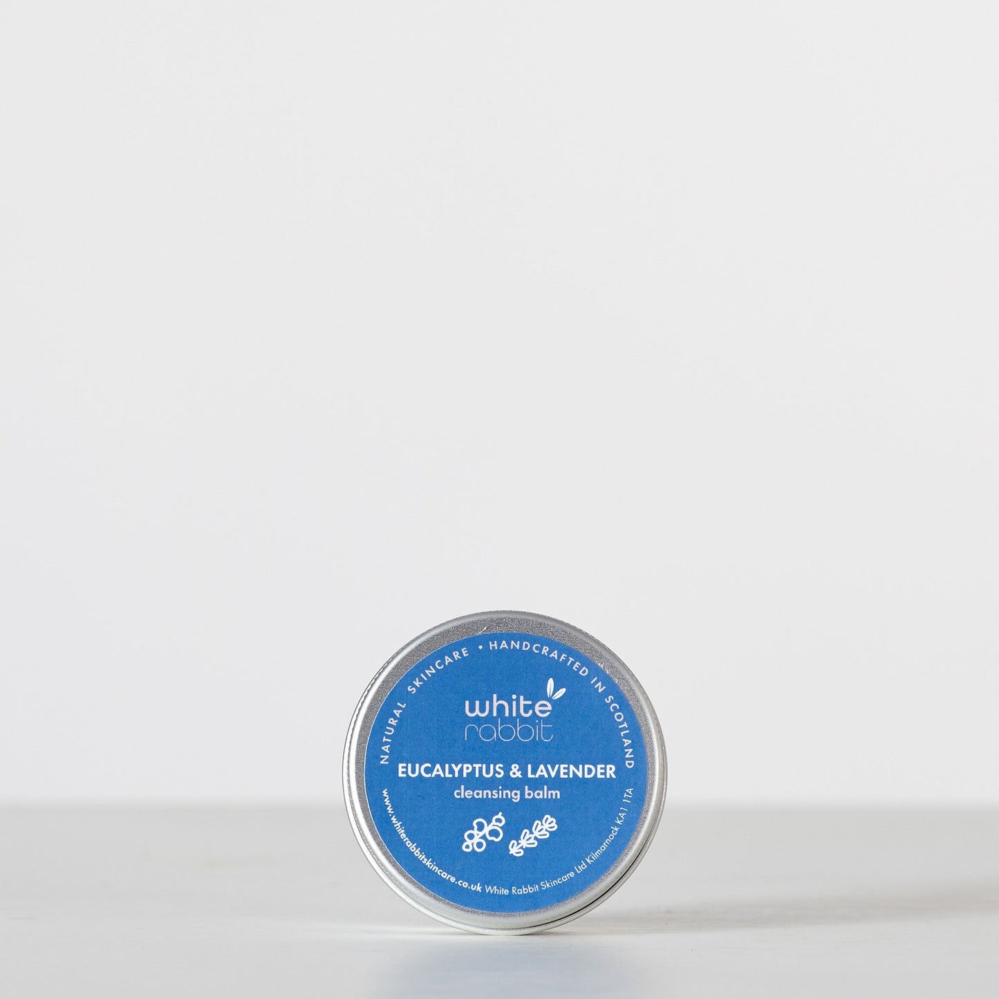 Cleansing balm tin labeled 'White Rabbit' on a white background