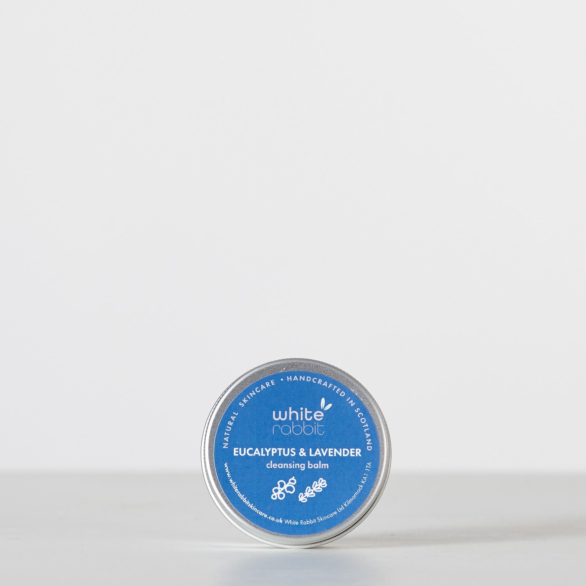 Cleansing balm tin labeled 'White Rabbit' on a white background