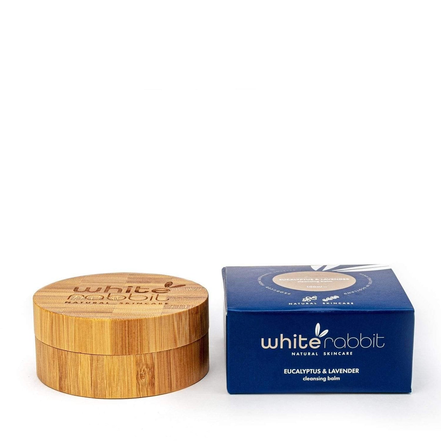 Wooden container and blue box with 'White Rabbit' branding on a white background