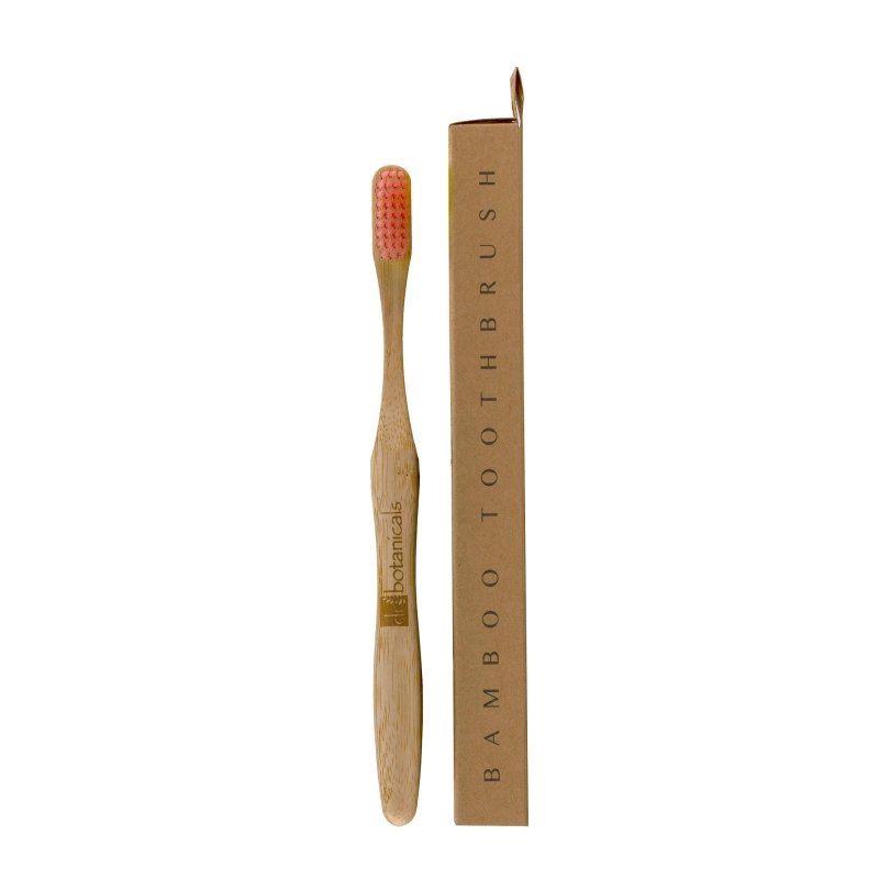 Bamboo toothbrush with brown packaging on a white background