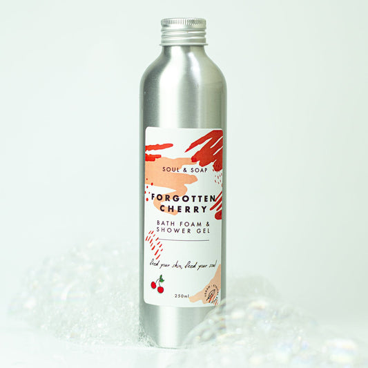 Bottle of 'Forgotten Cherry' bath foam and shower gel with a label on a white background