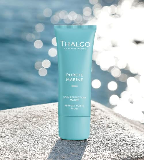 A tube of Thalgo Perfect Matte Fluid, which is a skincare product designed to control shine and regulate sebum production.