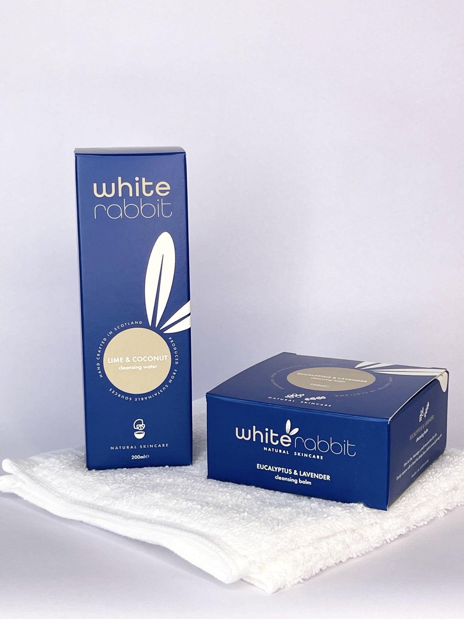 Two boxes of White Rabbit natural products on a white background
