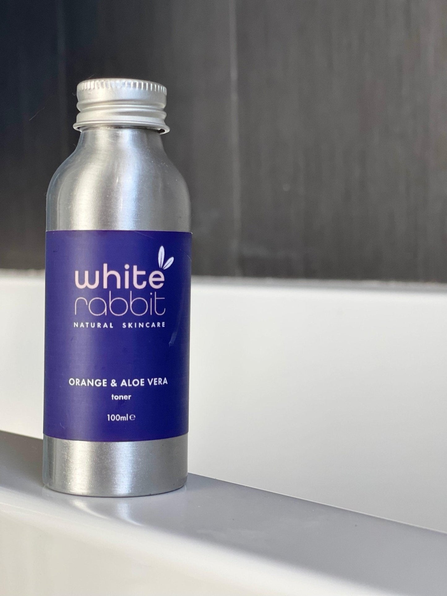 Silver bottle with a blue label featuring 'White Rabbit' on a neutral background