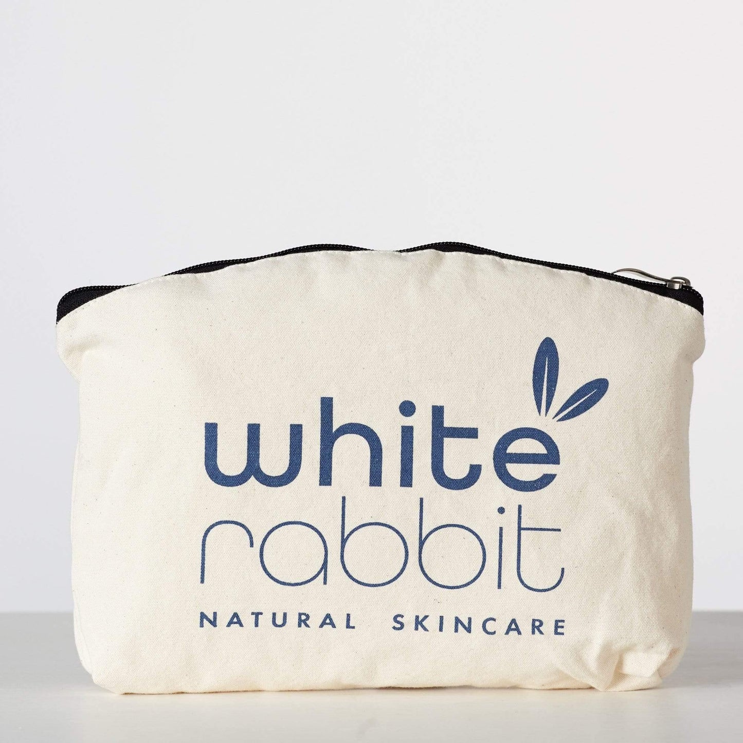 White Rabbit Natural Skincare pouch on a light background