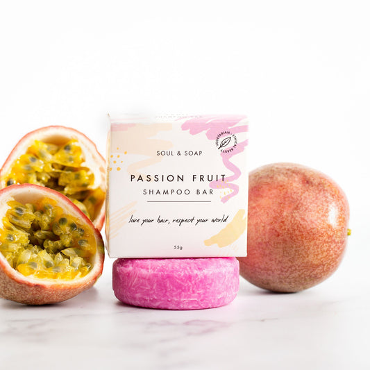 Passion fruit shampoo bar with passion fruit fruit and packaging on a white background