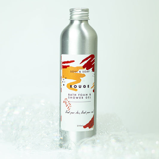 Bottle of bath foam and shower gel with a colourful label on a white background