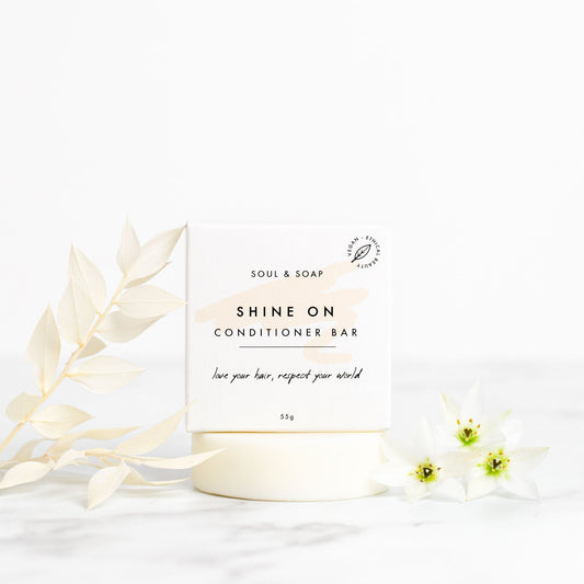 Conditioner bar with 'Soul & Soap' branding on a white background with decorative elements.