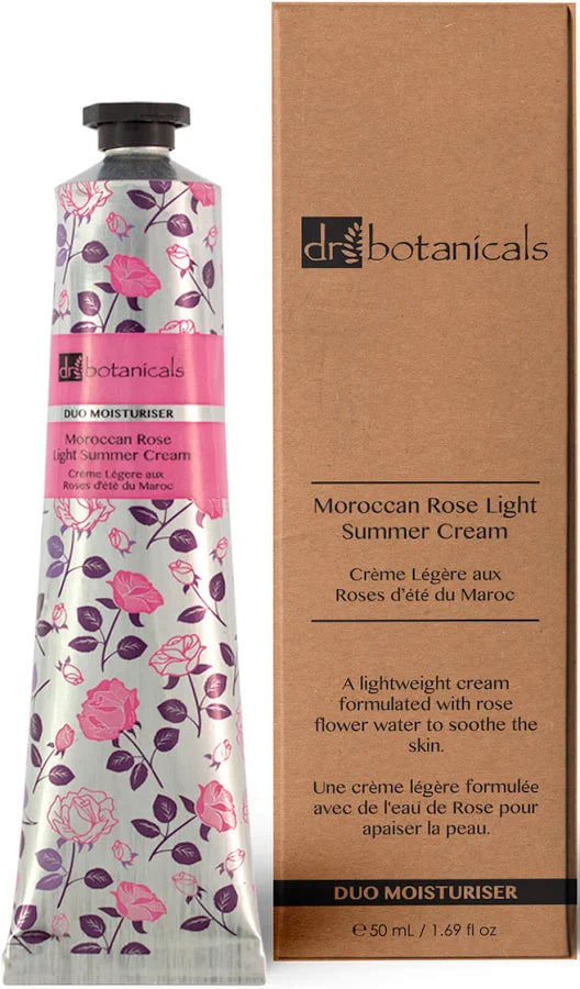 A tube of Dr. Botanicals Moroccan Rose Light-Summer Cream next to its brown cardboard packaging box, featuring a pink floral pattern on the tube.