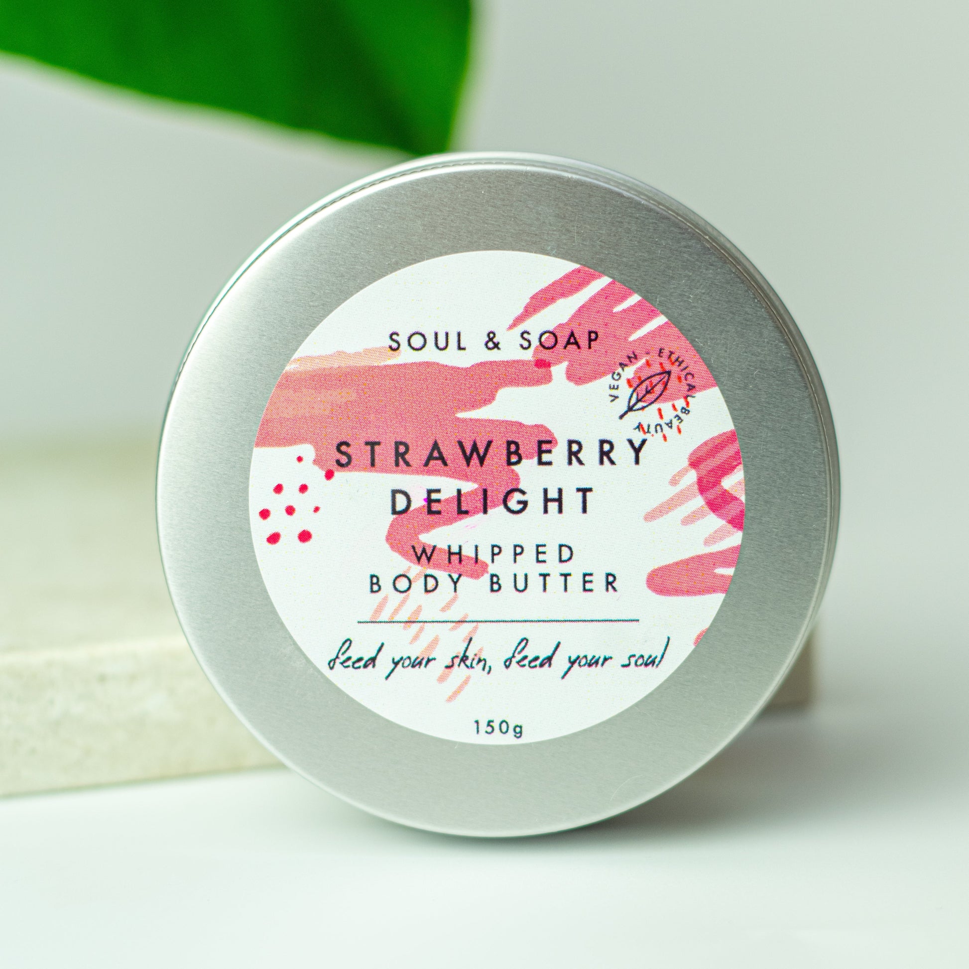 Strawberry Delight whipped body butter container with pink label on a white background