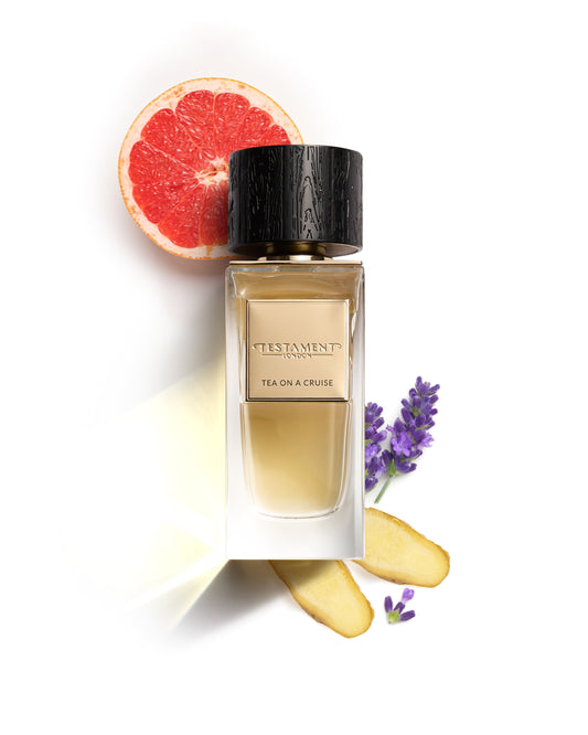 Perfume bottle labeled 'Tea on a Cruise' with a grapefruit half, lemon, and lavender flowers on a white background.