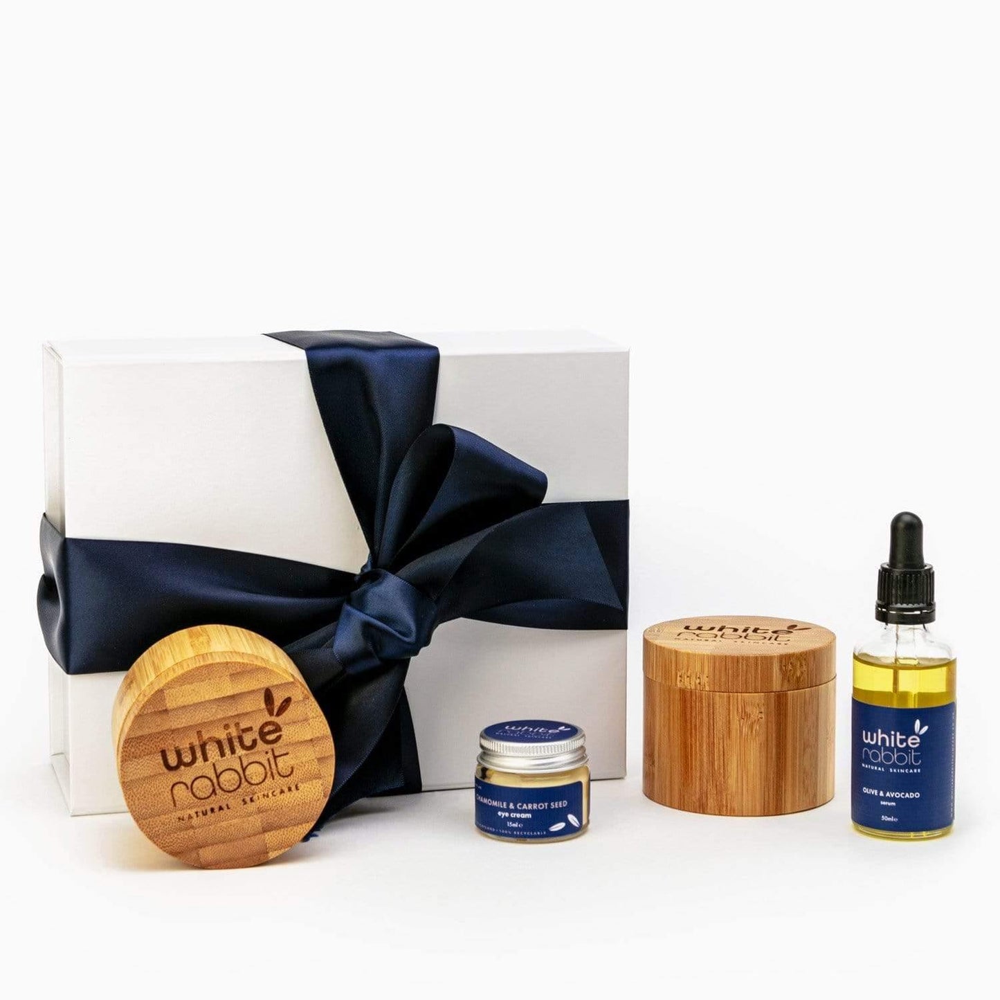 White Rabbit skincare products including a box, jar, and bottle on a white background