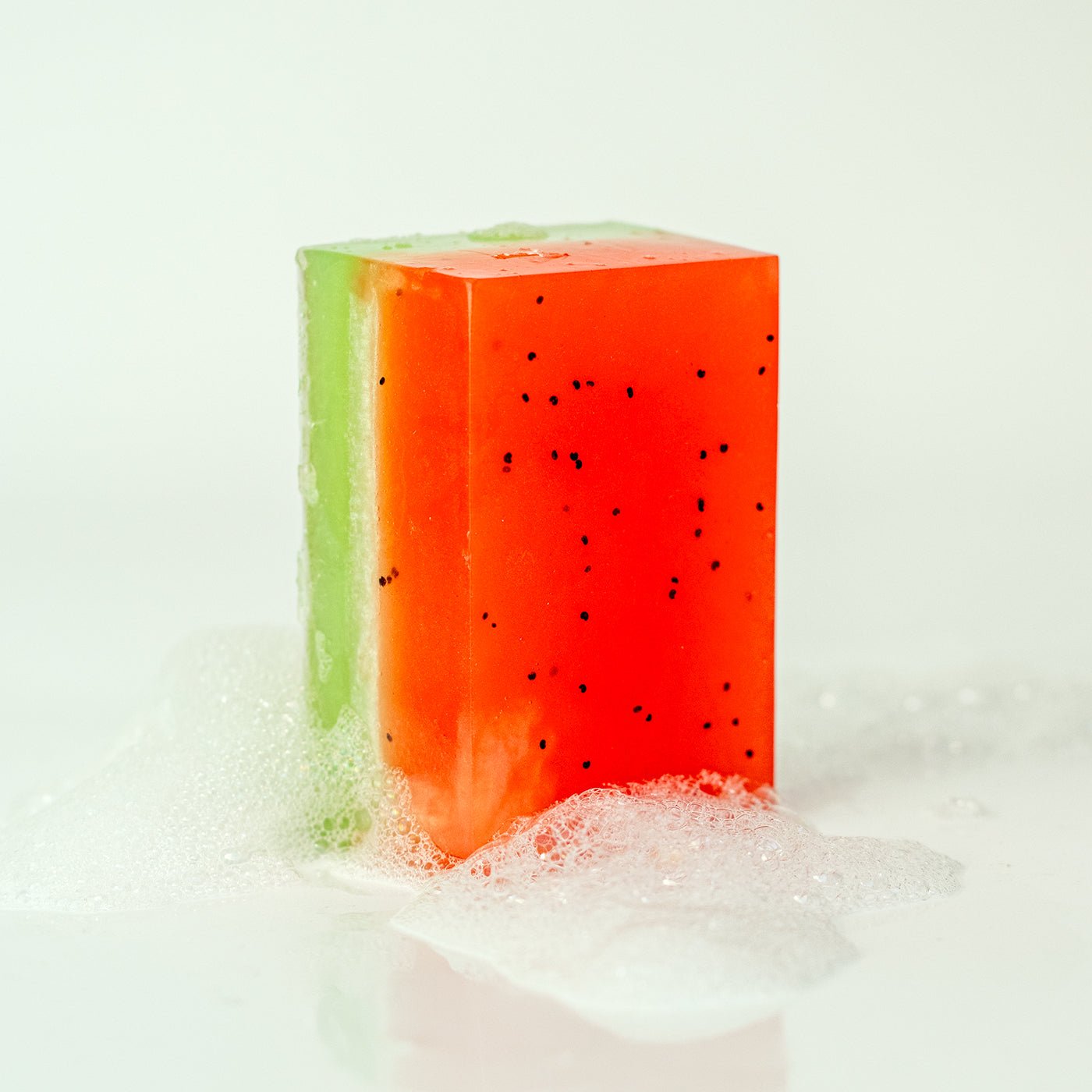 Bar of soap with watermelon design on a white background