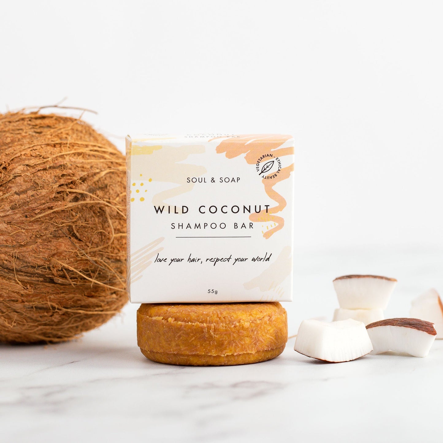 Wild Coconut shampoo bar with packaging on a white background
